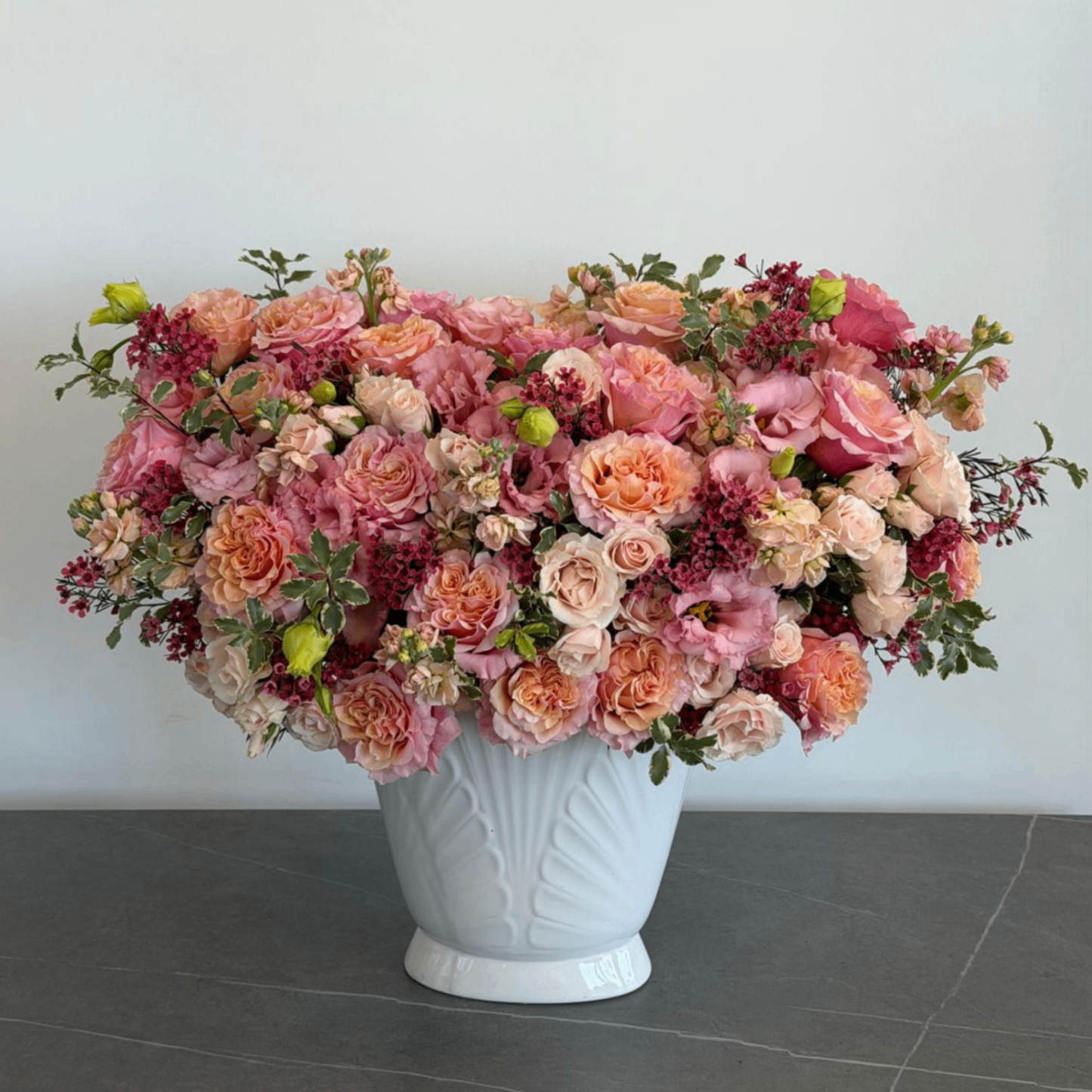 Pink peach roses berries white vase