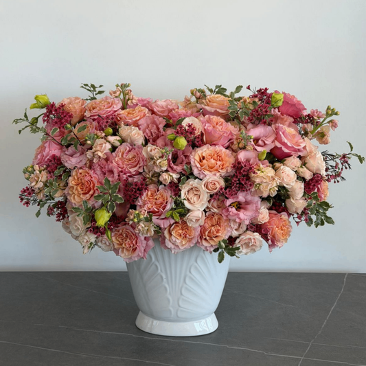 Pink peach roses berries white vase
