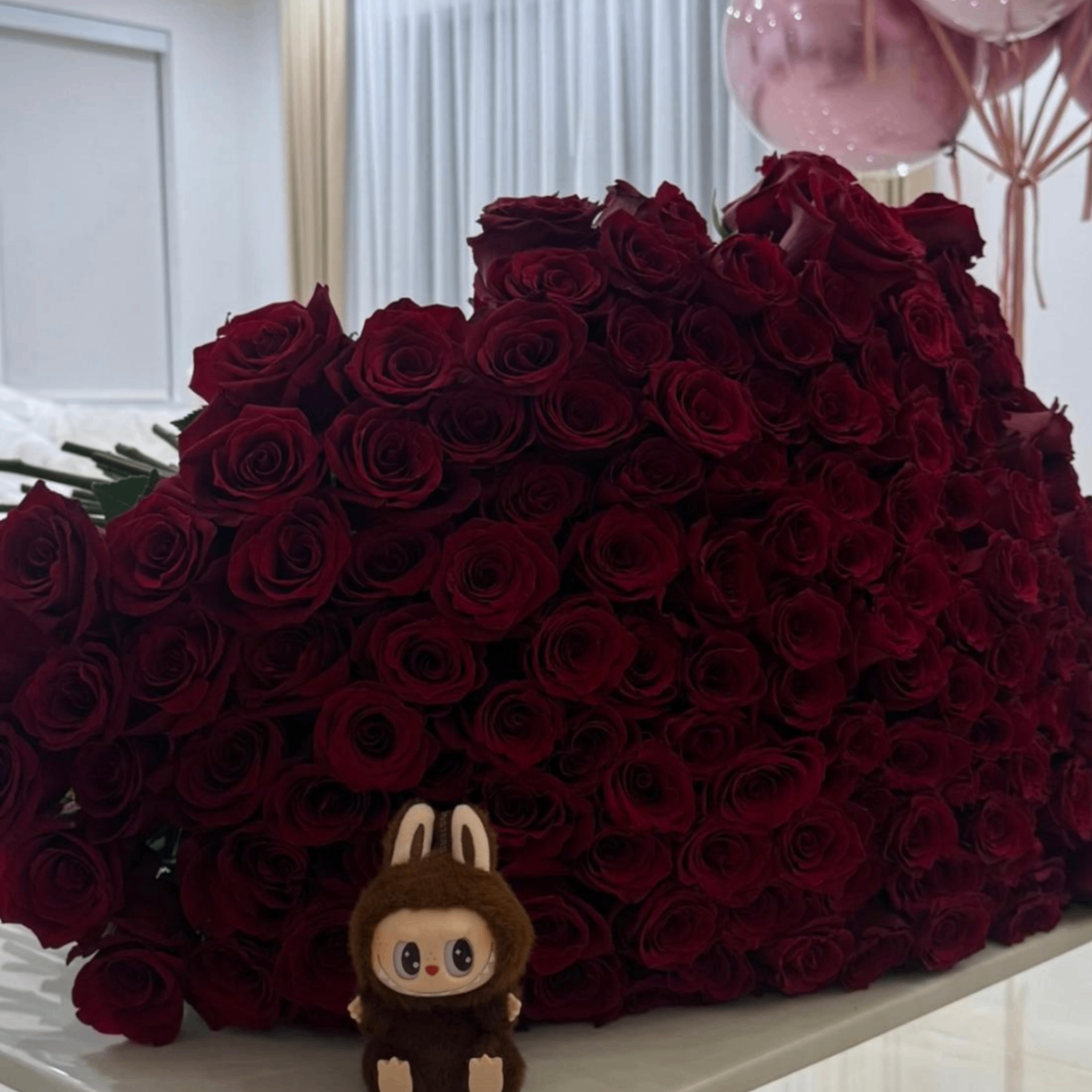 Pink coral roses with teddy bear
