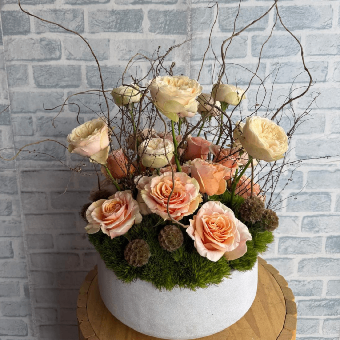 Peach rose woodland moss arrangement