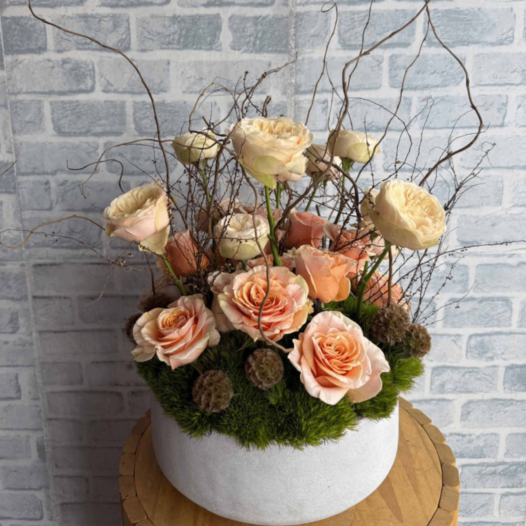 Peach rose woodland moss arrangement