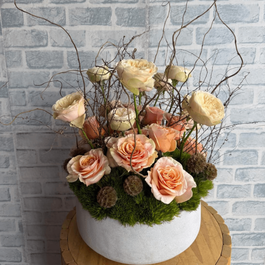 Peach rose woodland moss arrangement
