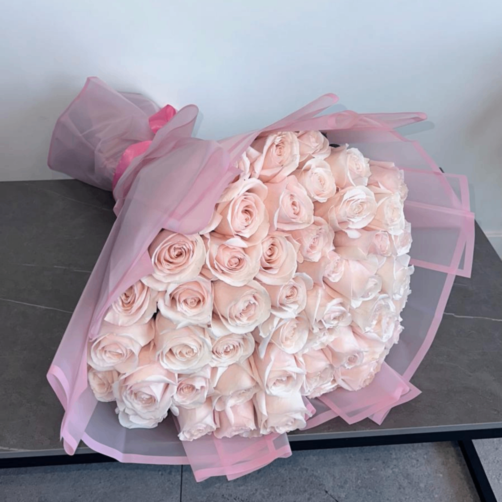 Preserved blush roses gray concrete bowl