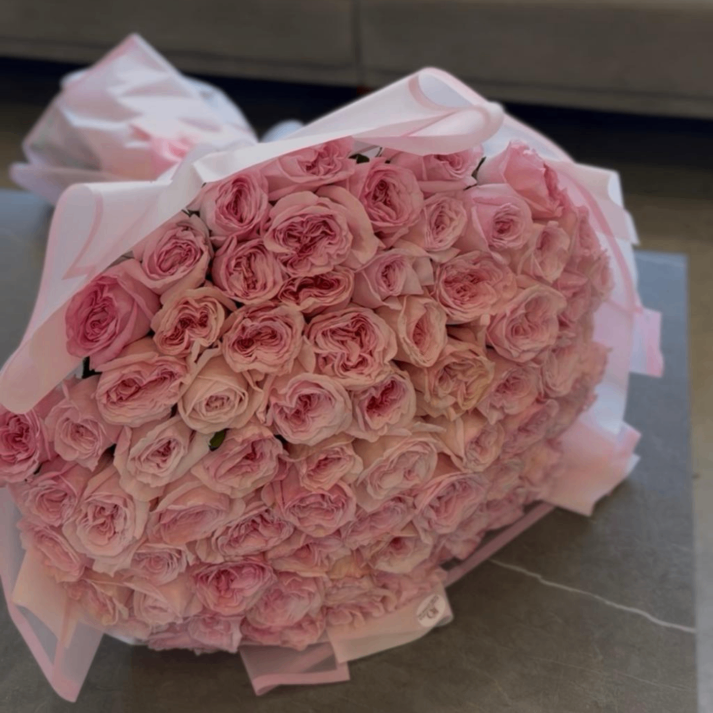 Pink garden roses white wrap bouquet